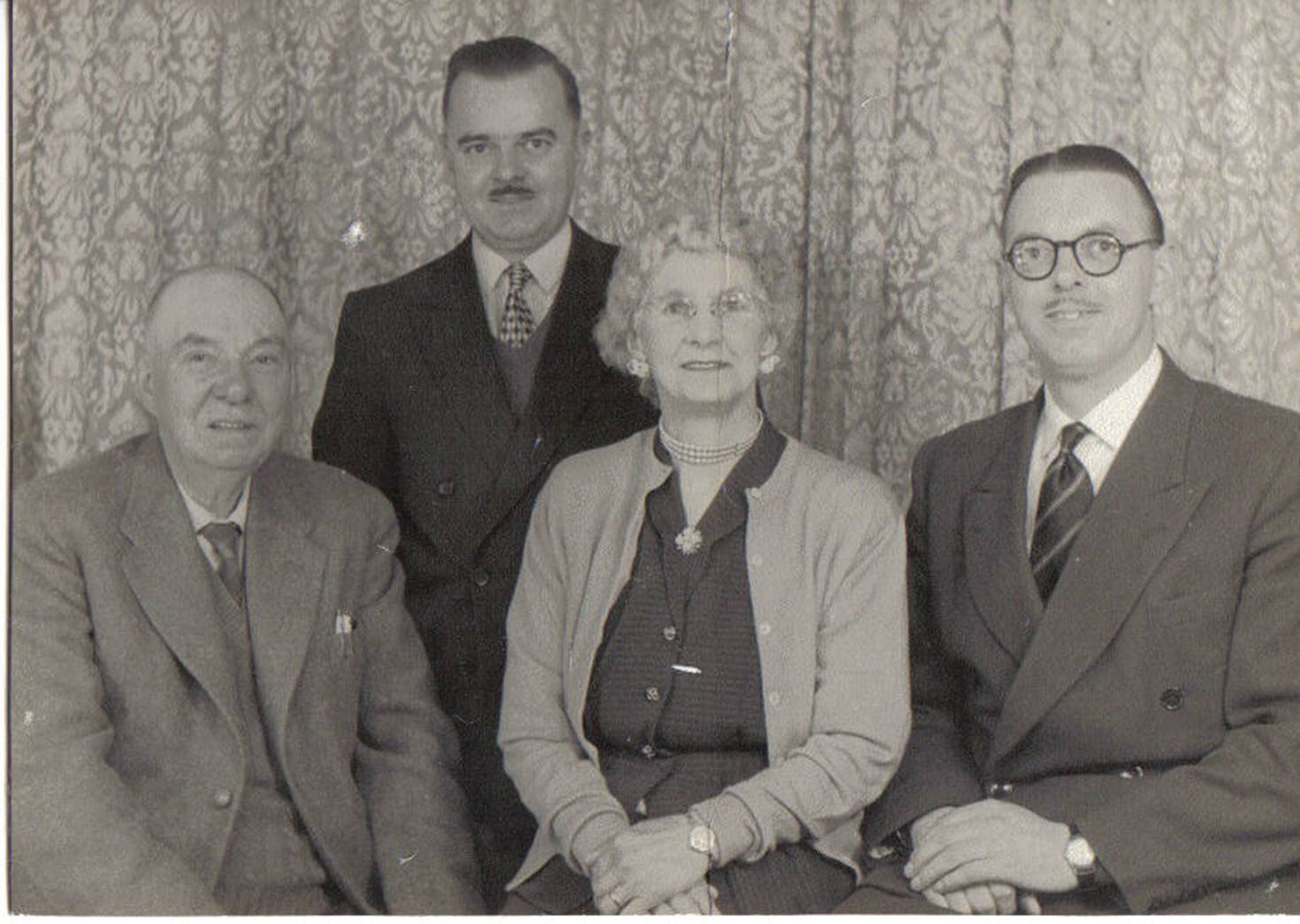 A group of people posing for a photo
Description automatically generated